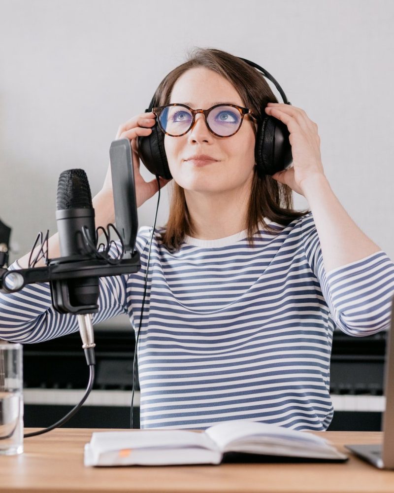 caucasian-woman-preparing-to-record-a-podcast-or-radio-recording-her-voice-for-an-audiobook.jpg